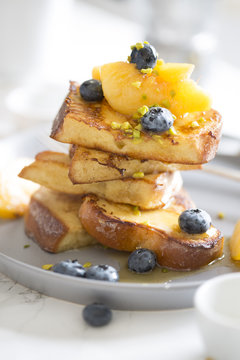 French toast with peach, bluberry and honey