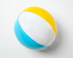 Inflatable ball on white background. Beach object