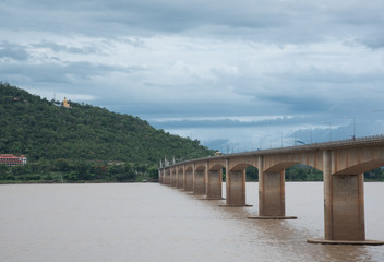 Fototapeta na wymiar andscape bridge cross of khong river with sunlight at Pakse Champasak Laos