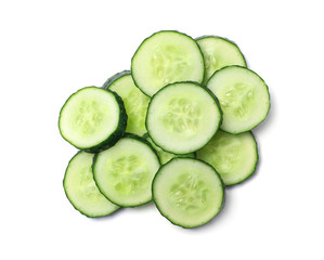 Slices of cucumbers on white background, top view