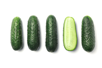 Flat lay composition with ripe cucumbers on white background