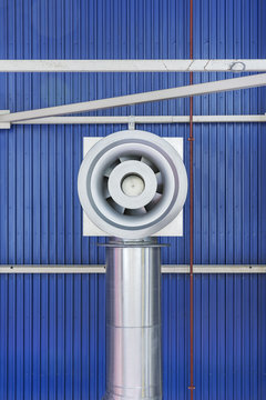 Air extractor on the ceiling of an industrial warehouse