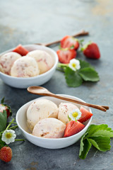 Strawberry ice cream in white bowls