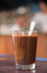 Antique coffee on a table with a shop on background
