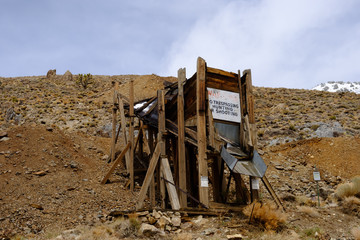 Fototapeta na wymiar Abadoned mineshafts and associated wooden structures dot the Sierra Mountain landscape of Eastern California