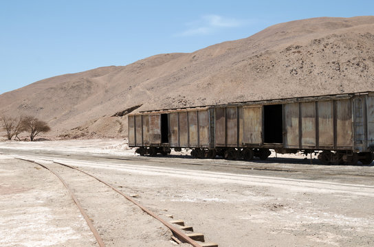 Abandoned old train carriage in the middle of the desert