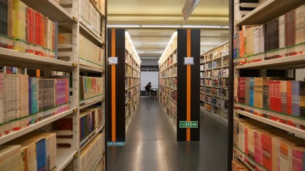 guangzhou city library reading hall shelfs slow motion walking view
