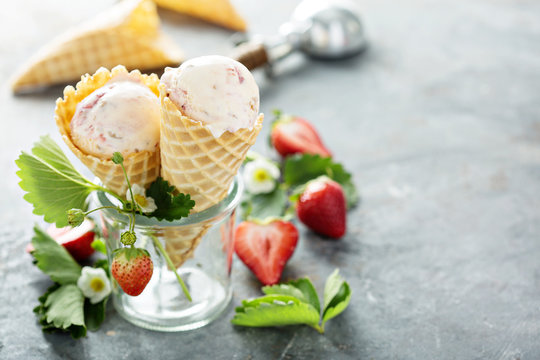 Strawberry ice cream in waffle cones