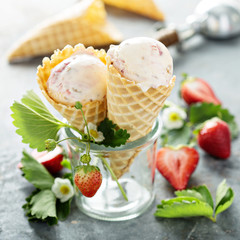 Strawberry ice cream in waffle cones