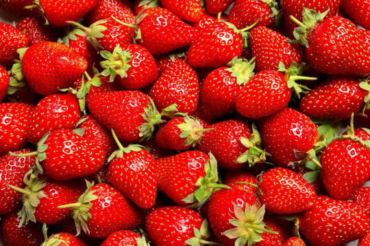 Fresh ripe strawberries as background, top view