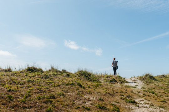 Man on a hike, exporing the dunes