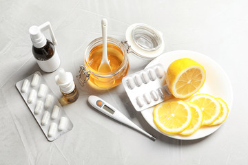 Natural and medical cold remedies on table