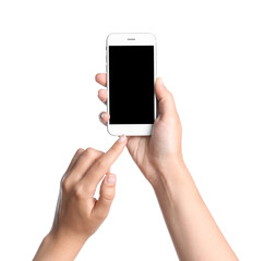 Young woman holding mobile phone with blank screen in hands on white background