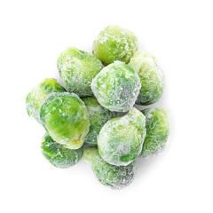 Frozen brussel sprouts on white background. Vegetable preservation