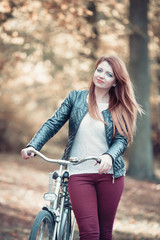 Obraz na płótnie Canvas Young girl with bike.
