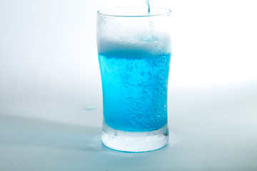 Glass of blue liquid