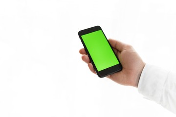 Close-up of male hands using smartphone near the window. Close up. Tracking motion. Vertical. pants.