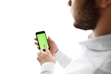 Close-up of male hands using smartphone. Chroma Key. Tracking motion.