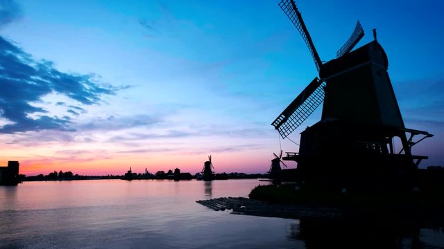Windmills at Zaanse Schans in Holland on sunset. Zaandam, Nether