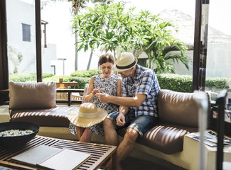 Couple waiting in a hotel lobby