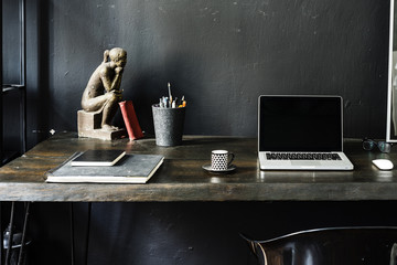 Dark home office with black walls