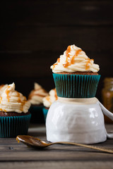 Caramel cupcakes on a dark background