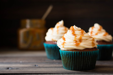Caramel cupcakes on a dark background