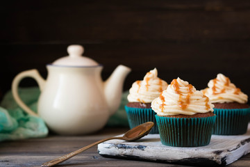 Caramel cupcakes on a dark background