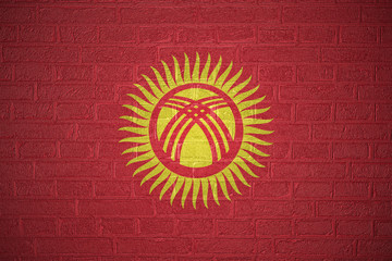 Flag of Kyrgyzstan on brick wall, 3d illustration