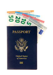Fototapeta premium U.S. Passport with European banknotes euros sticking out of the top. Travel from the U.S. to Europe, planning ahead getting money converted