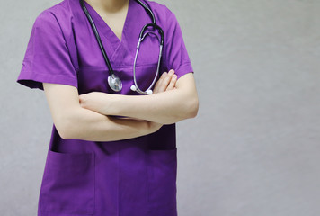 Doctor crosses her arms.