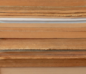 background. books, pages lie horizontally on the shelf