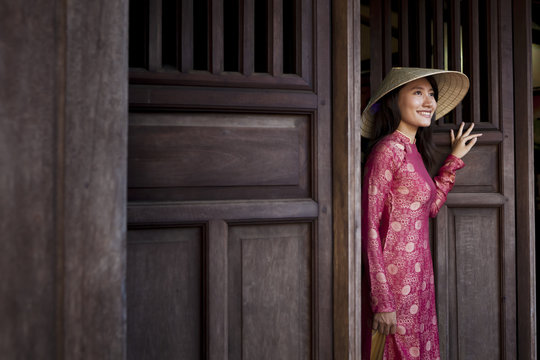 Vietnamese Woman smiling in her ao dai