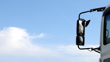 rear view mirror of a running truck