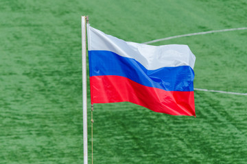Russia Day. Russian flag against the background of a football field