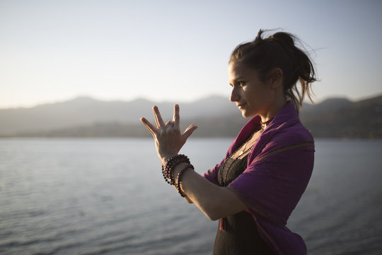 Woman doing mudras in nature