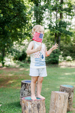 Child holding American flag