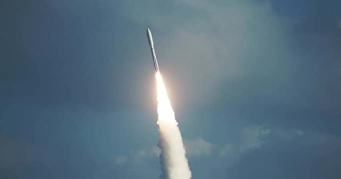 Tracking shot of missile rocket flying into space after launch
