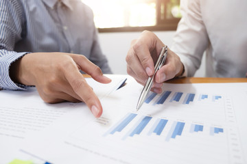 Two businessman are discussing about business growth and planing.