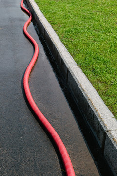 red cable on the sidewalk