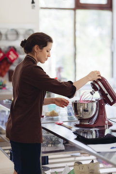 Woman making pink dough