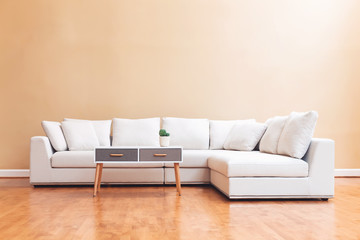 White sectional couch in a large luxury interior home