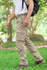 male tourist in the park. Tourism and travel concept, cargo pants