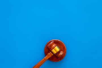Law and court. Lawyer, attorney, judge concept. Judge gavel on blue background top view copy space