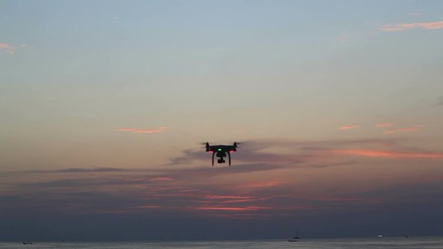 drone making an aerial movie at Karon beach during sunset
