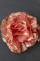 Italian prosciutto crudo or jamon. Raw ham. Top view