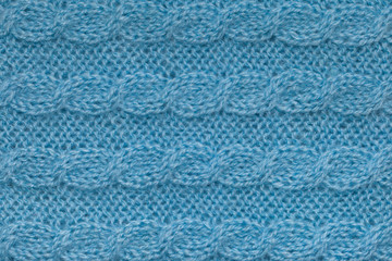 Light blue knitting texture with aran pattern, horizontal knit cable background