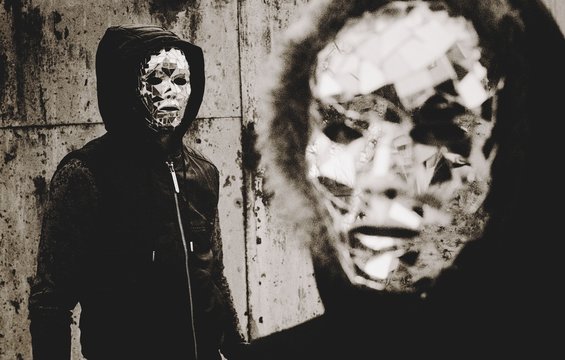 People in mirror masks