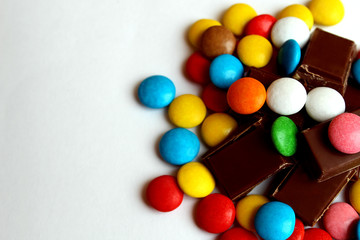 chocolate segments in a pile with a small dragée