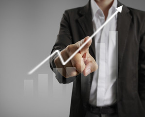 Businessman with financial symbols coming